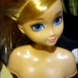 A baby doll that you can brush hair and do makeup